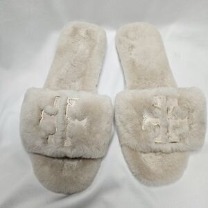 Tory Burch Cream Shearling Slippers.